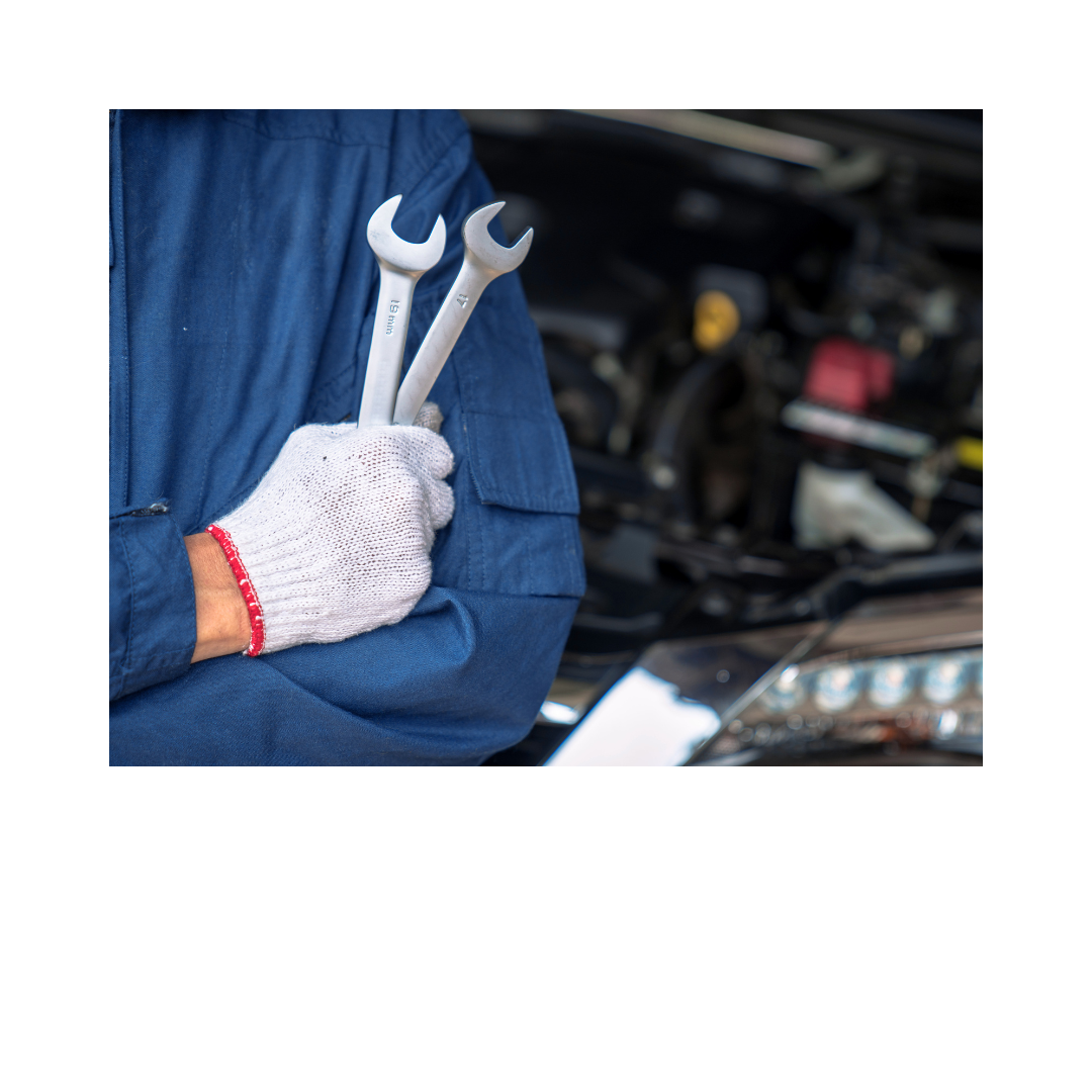Close-up of maintenance technician holding wrenches with protective gloves
