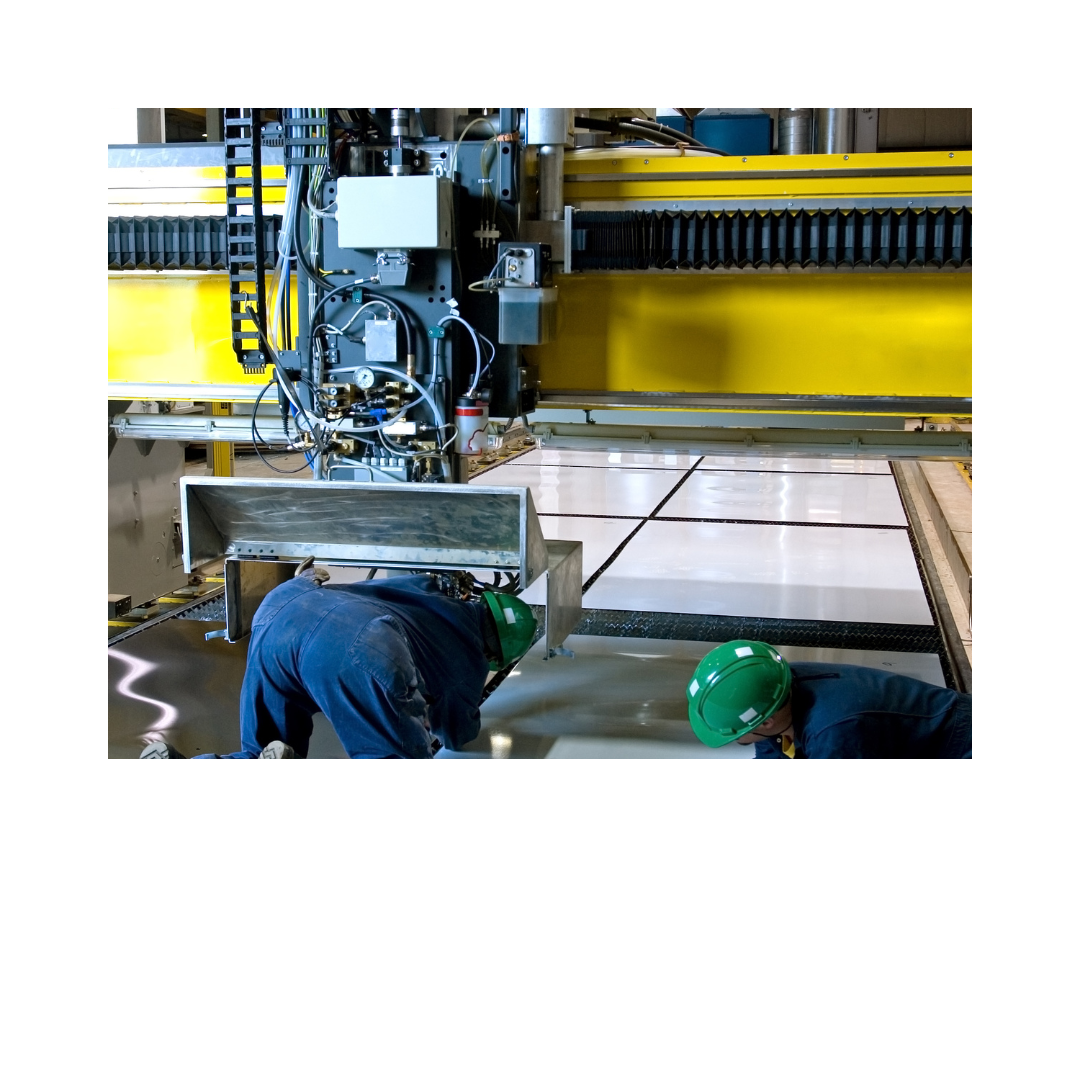 Professional technicians in safety gear installing industrial equipment